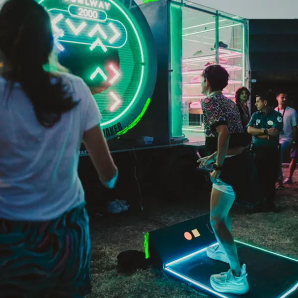 Young adult dancing on a dance mat game